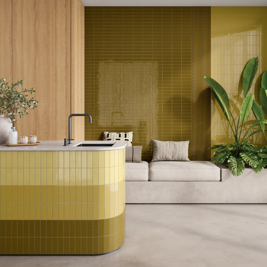 Kitchen and seating nook with Micare Alpi Light, Medium and Dark tiles, including Canale Alpi Dark on the wall.