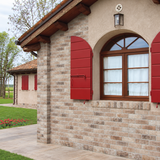 AI-styled cottage exterior with London Brick Beige 60x250mm brick-look porcelain wall tiles and red shutters