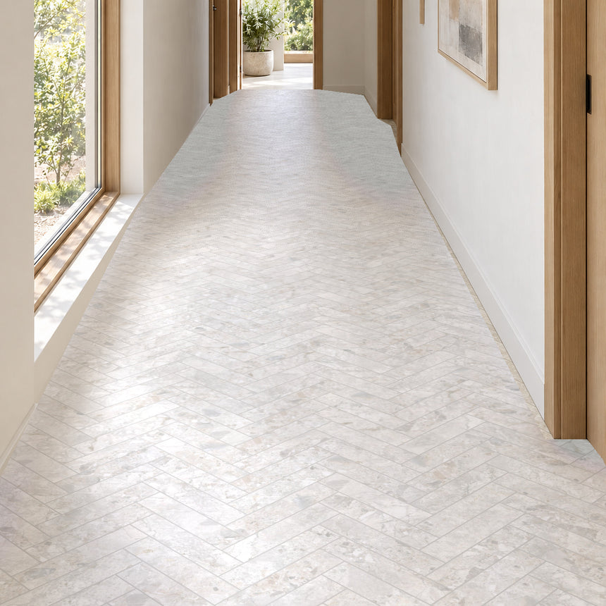 Matera Luna White 60x250mm stone look subway tiles in a herringbone hallway floor with natural daylight, design illustration