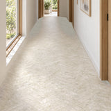 Matera Sola Beige 60x250mm stone look subway tiles in a herringbone hallway floor with natural daylight, design illustration