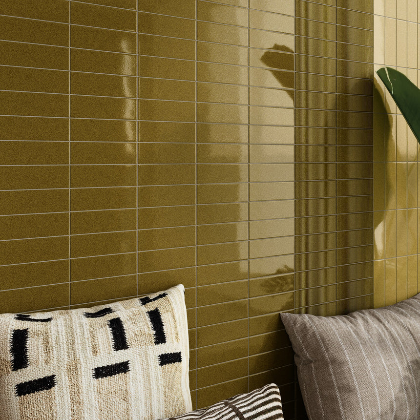 Micare Alpi Medium and Dark wall tiles with a Canale Alpi Dark relief strip beside a built-in seat.