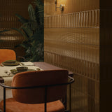 Restaurant dining area with Micare Ambar Dark flat, Canale and Rim tiles across the feature wall.