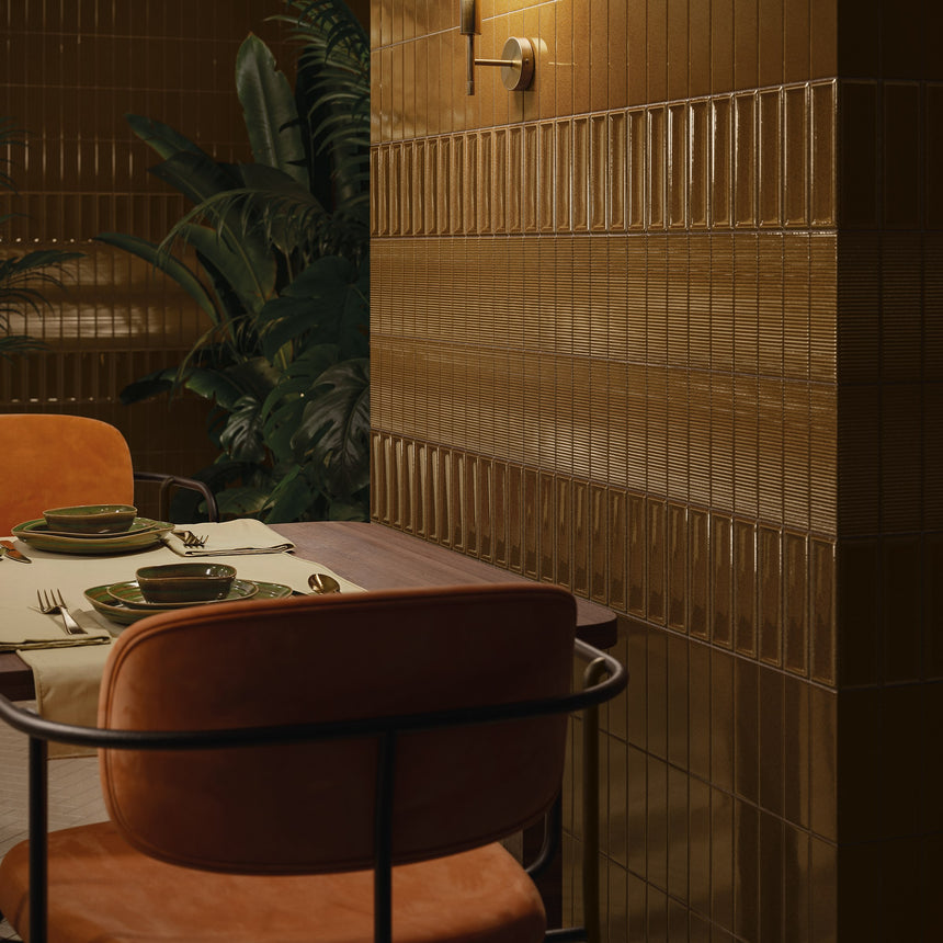 Restaurant dining area with Micare Ambar Dark flat, Canale and Rim tiles across the feature wall.