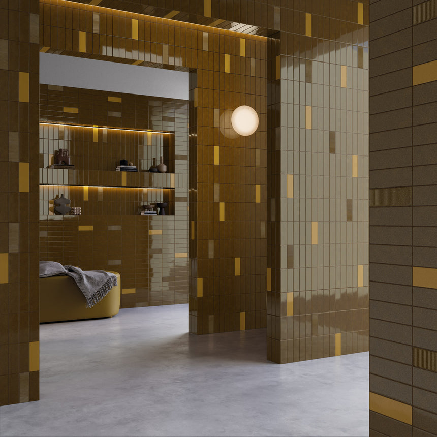 Bathroom wall combining Micare Ambar Dark with Ambar Light accents and Canale Ambar Dark relief tiles.