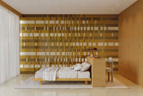 Bedroom feature wall mixing Micare Ambar Medium, Ambar Dark and Linen Medium tiles, with a Linen Medium floor.