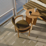 Cafe floor detail showing a mix of Micare Linen Light, Medium and Dark tiles beside timber seating.