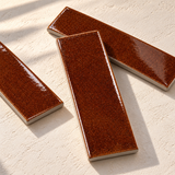 Micare Saffron Dark Gloss Porcelain Wall Tile 50x150mm — AI-generated styled preview; refer to original tile photo and physical sample for colour and finish