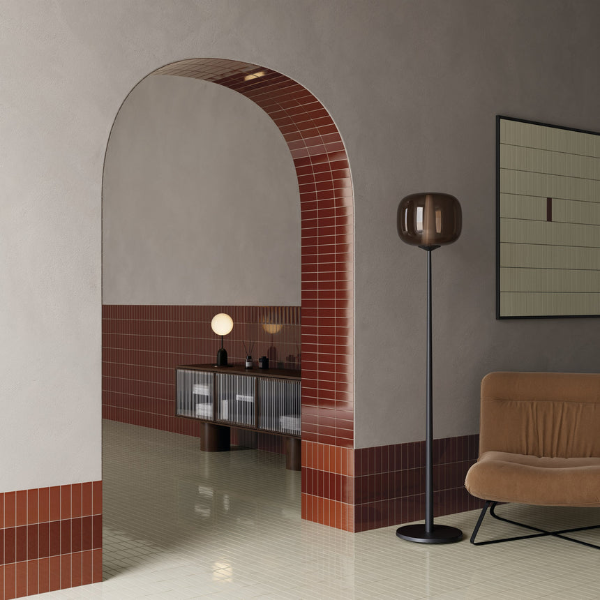 Arched room entrance with Micare Saffron Medium and Dark wall tiles, Rim Saffron Dark borders and a Linen Light floor.