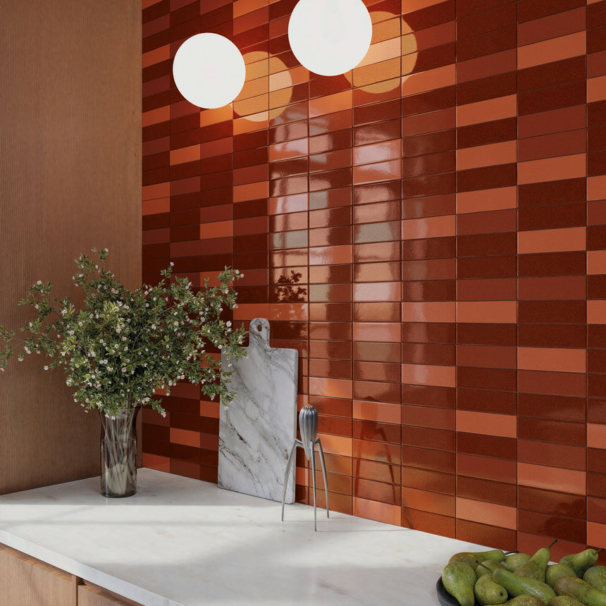 Kitchen splashback detail mixing Micare Saffron Light, Medium and Dark gloss porcelain tiles.