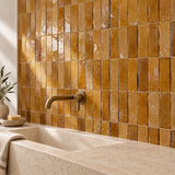 Caramel Zellige Bejmat feature wall design illustration with limestone vanity and brass tap